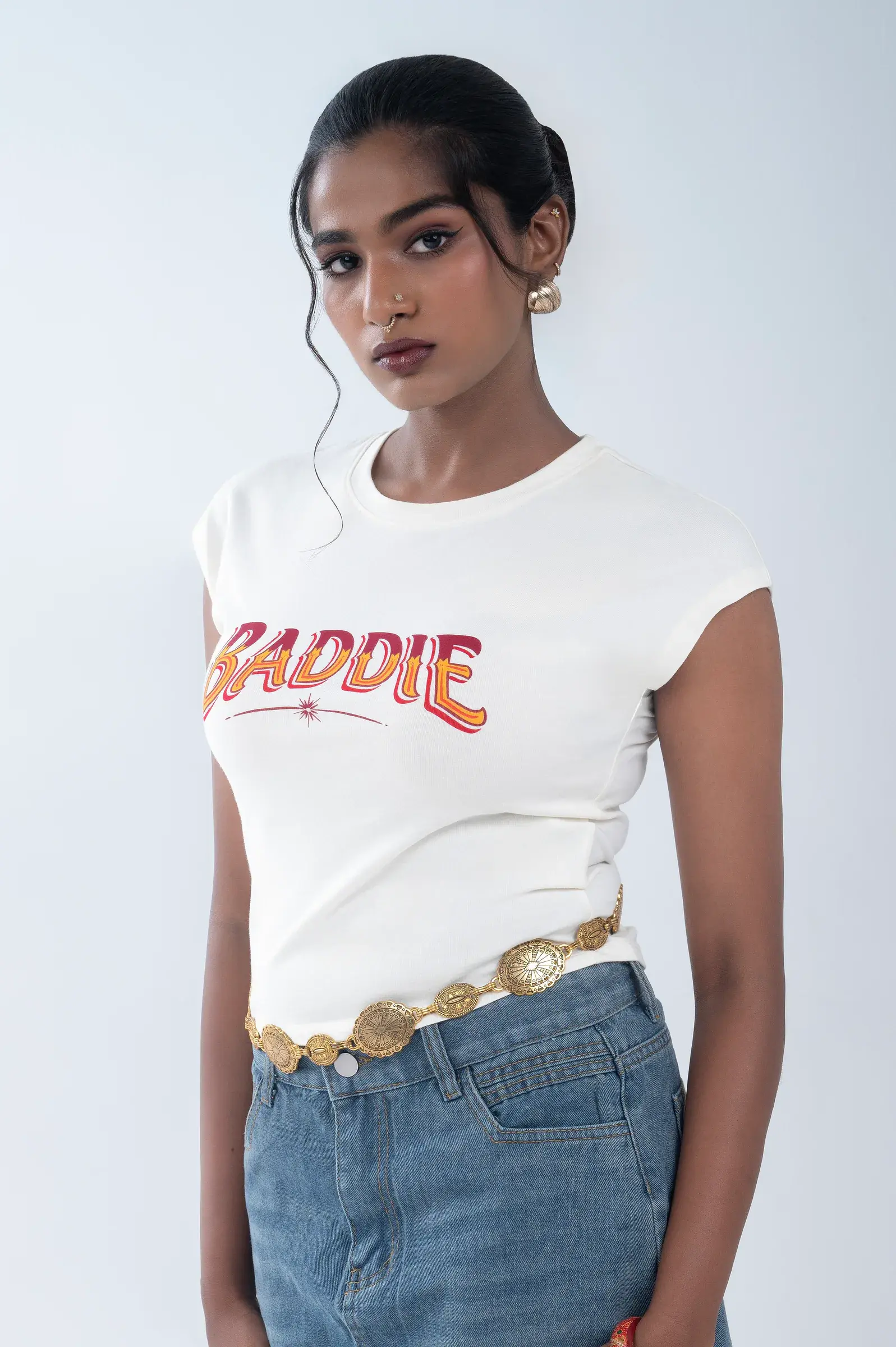 Model wearing a white 224dot graphic tee