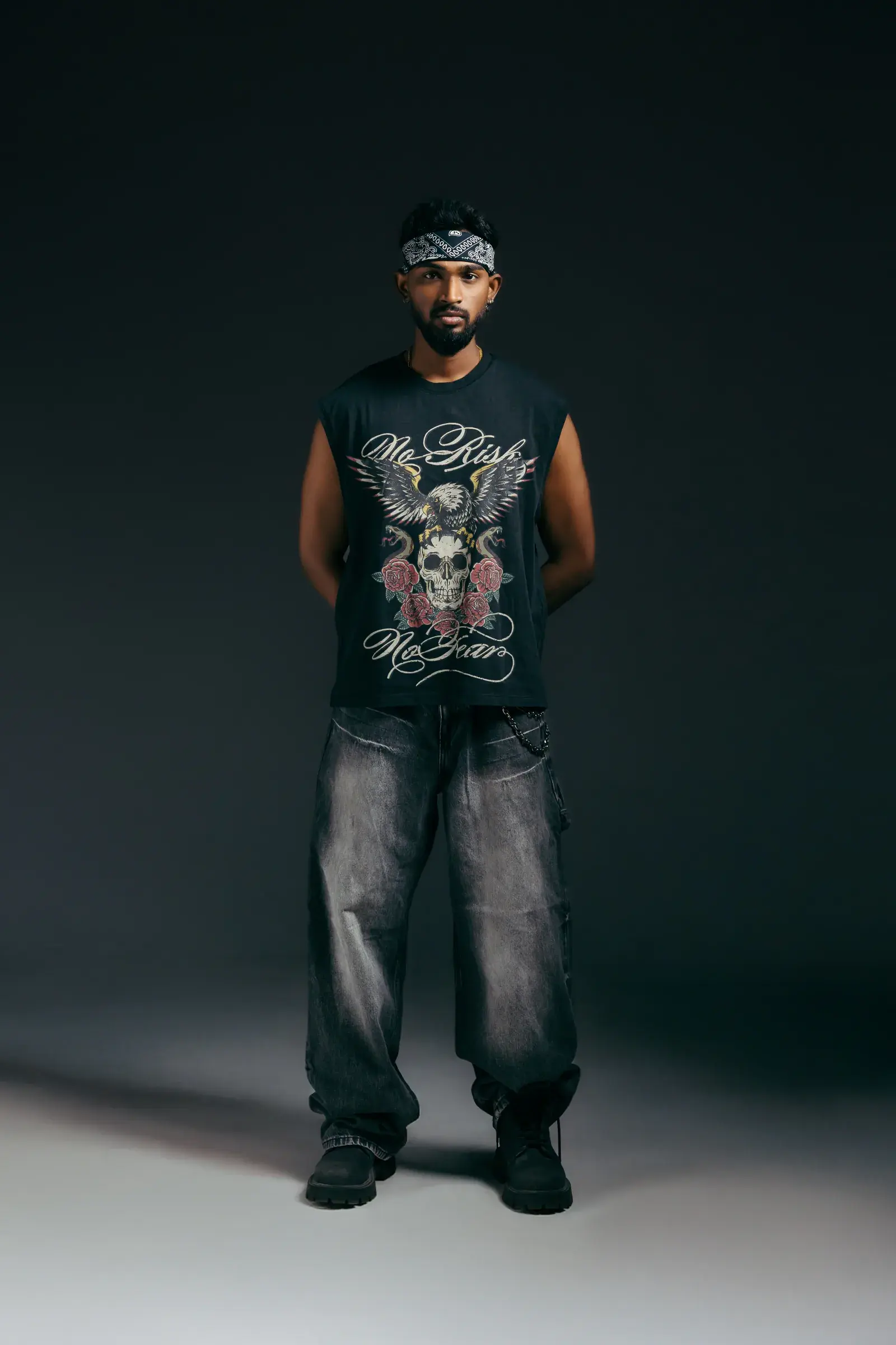 Model in a dark 224dot graphic sleeveless top